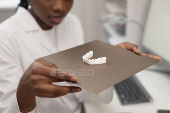 Engineer Holding Print Bed with 3D Jaw Prototype