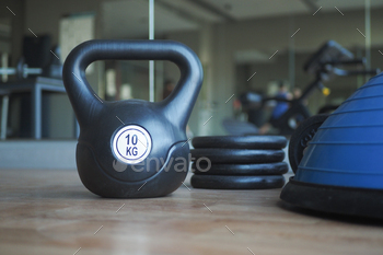 Gym Equipment or Dumbbell Kettlebell in a gym bench