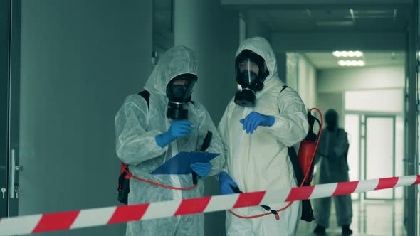 Disinfectors Work in Restricted Area During Pandemic.