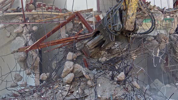 Hands Shot Of Excavator Demolishing House 3