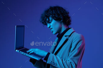 man with a laptop in his hands and a jacket, smile, glasses in blue light, Blue Perennial color