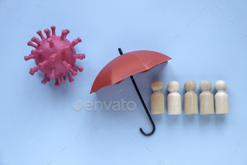 ept. Wooden people under a red umbrella.