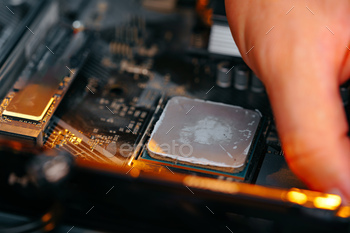 Male hands repairing computer hardware close up
