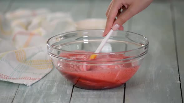 Woman Making a Summer Berry Mousse for Cake