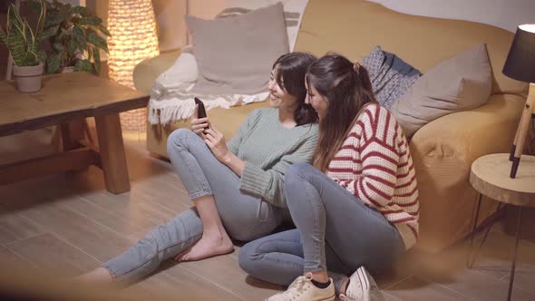 Happy Couple of Female Friends Landlord Tenants Sit on Sofa Taking Selfie