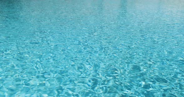 Blue Clear Water in Hotel Pool on Sunny Day