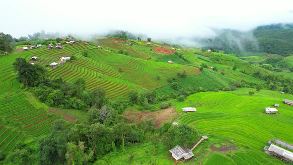 Aerial drone footage of rice terraces and farmer village at Pa pong piang