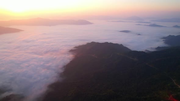 Flying over the clouds during morning sunrise.  wonderful morning sunrise natural Landscape.