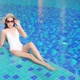 Young asian woman enjoy around outdoor swimming pool for leisure - VideoHive Item for Sale