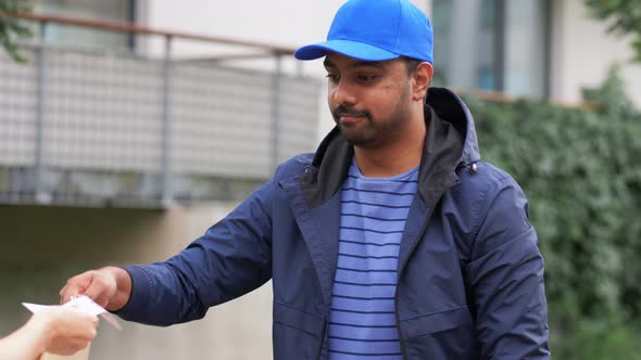 Happy Food Delivery Man Giving Order to Customer