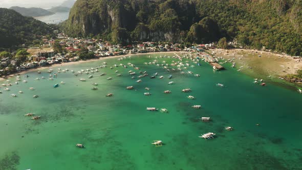 Tourist Boats in a Bay with Blue Water