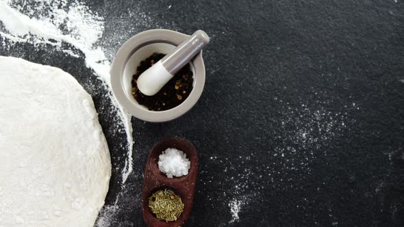 Pizza dough and flour with ingredient