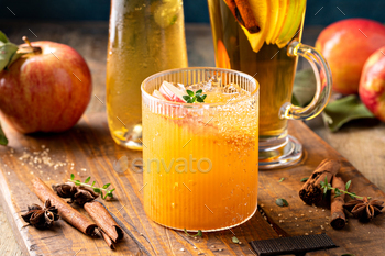 Apple cider margarita with apple slices and fresh thyme