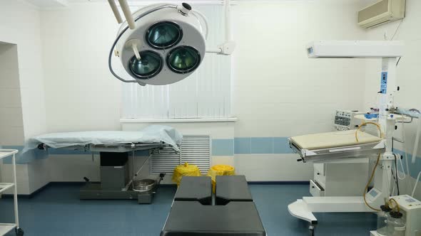 Long Shot of Surgery in a Maternity Clinic with Operaation Lights Turned Off