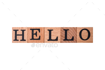 The inscription hello on wooden cubes on a dark concrete background