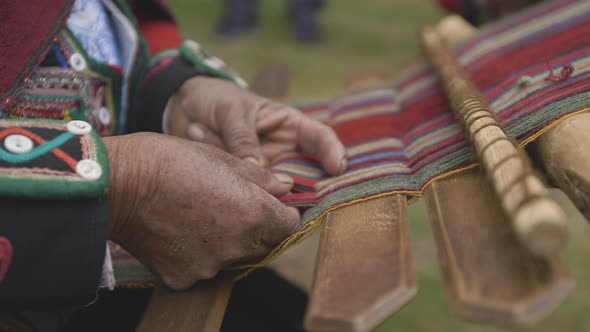 Macro of natural weaving in Peru on a traditional loom