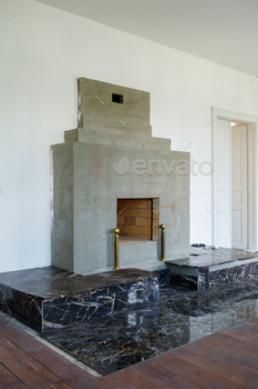 The process of finishing a large fireplace with black marble
