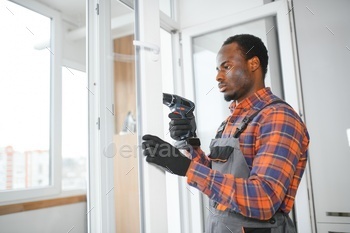 African service man installing window