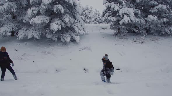 Kids playing snowballs.