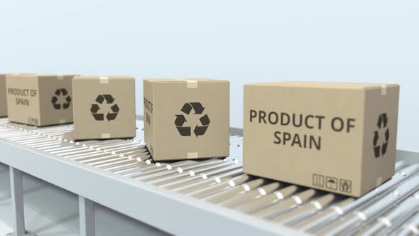 Boxes with PRODUCT OF SPAIN Text on Roller Conveyor