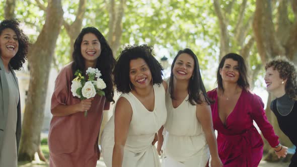 Brides and Guests Standing in Line and Jumping at the Same Time