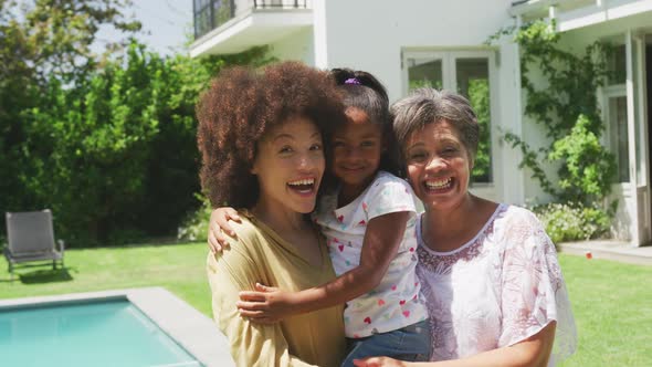 Mixed race woman spending time with her mother and her daughter