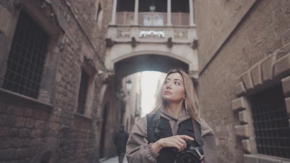 Tourist Girl with Dslr Photo Camera Walking Through Old Town