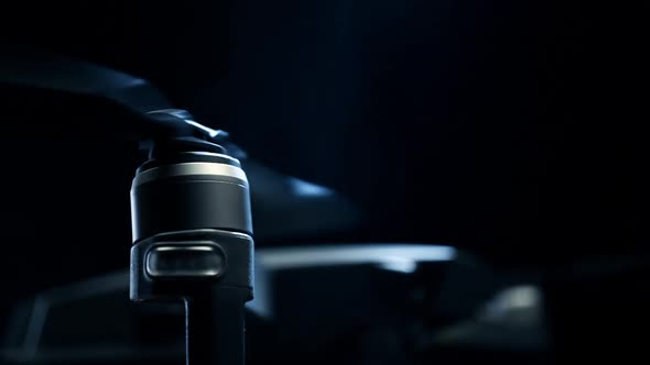 Close-up Spinning Drone Propellers on Black Background. Modern Technologies for Shooting Photos and