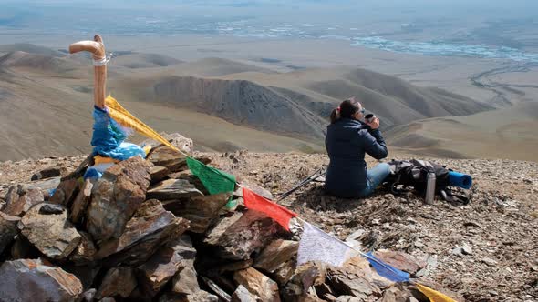 Woman Enjoying Scenery From the Top of Mountain