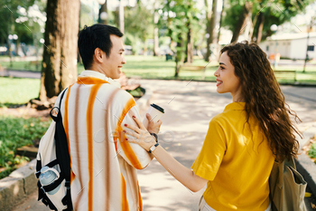 Dates chatting during stroll in park