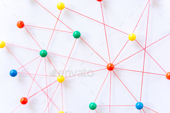 connection between the two networks. Network simulation on paper linked together by yarn