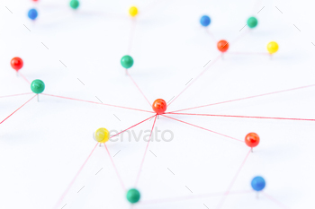 The connection between the two networks. Network simulation on paper linked together by yarn