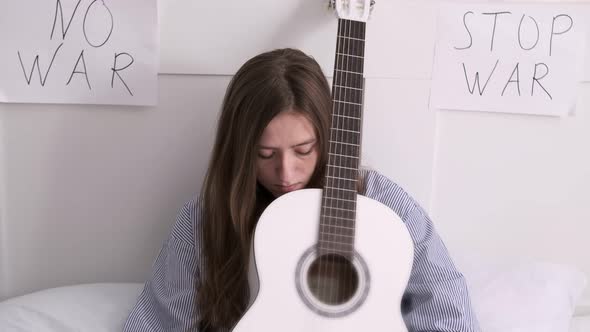 Woman Plays Guitar