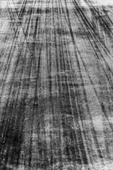 Tire track mark on asphalt tarmac road race track texture and background, Abstract background black.