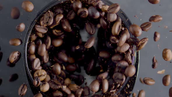 Roasted Coffee Beans Spin in Grinder Top View Closeup