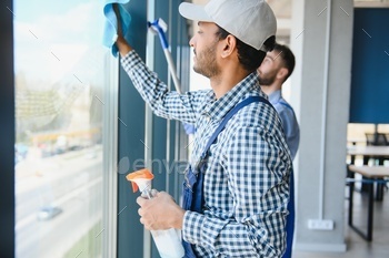 A man cleaning windows. cleaning team of men washes the windows