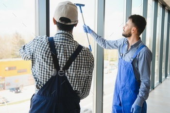 A man cleaning windows. cleaning team of men washes the windows