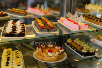 Showcase with sweets. Various desserts and cakes for sale