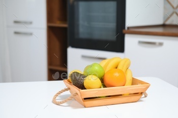 fruits in a wooden box in the kitchen. handmade box.