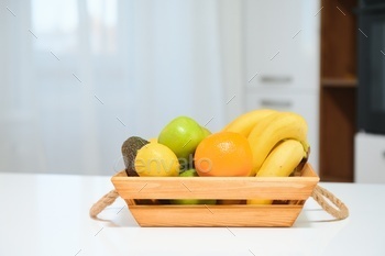 fruits in a wooden box in the kitchen. handmade box.