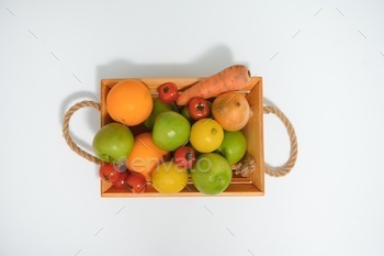 fruits in a wooden box in the kitchen. handmade box.