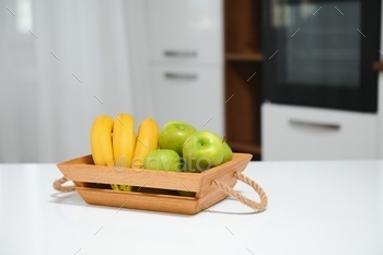 fruits in a wooden box in the kitchen. handmade box.