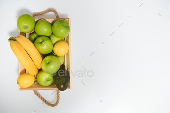 fruits in a wooden box in the kitchen. handmade box.