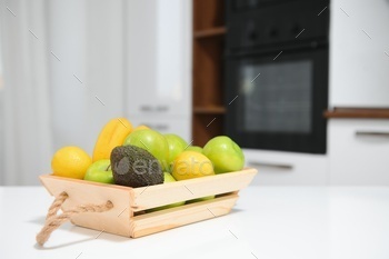 fruits in a wooden box in the kitchen. handmade box.