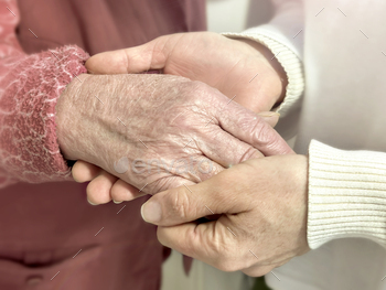 Interweaving of generations hands of young,old people. Touch of the hands of a hands of an elderly