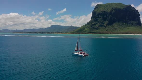 Catamaran in Turquoise Water Against the Background of the Paradise Island Mauritius