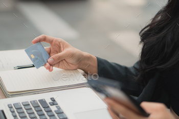 A person using a payment card to pay online