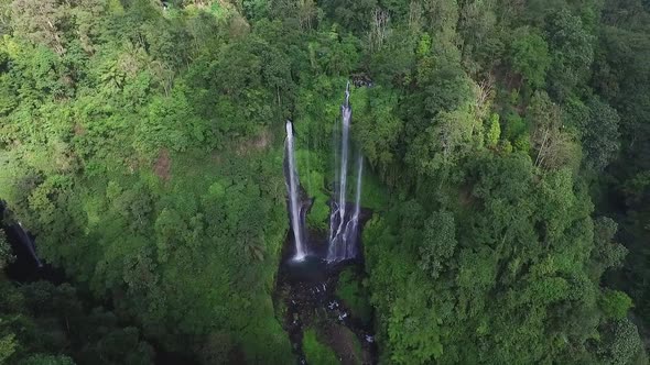 Aerial View of Waterfall in Green Rainforest