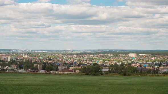 Timelapse of Summer sunny city with low buildings.