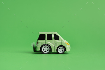 The concept of the environment. The concept of ecology. Green car on a green background.